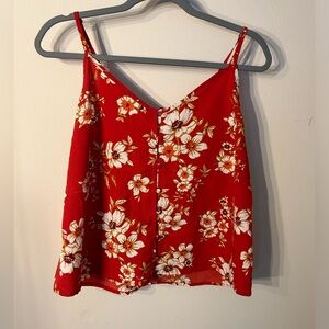 Silky red Japna tank top featuring gold and white flowers.